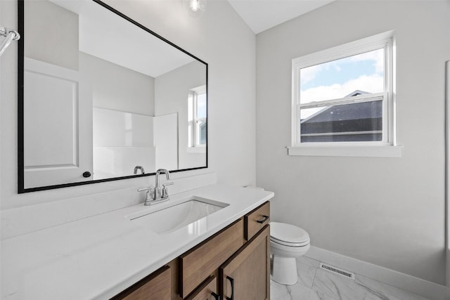 bathroom with vanity and toilet