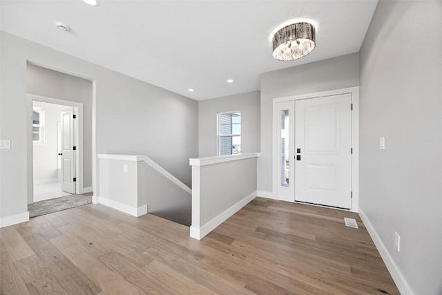 foyer entrance with light hardwood / wood-style flooring