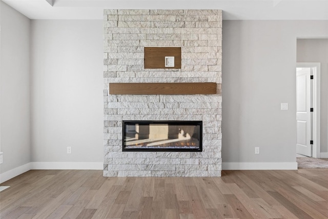 interior details with hardwood / wood-style floors and a fireplace