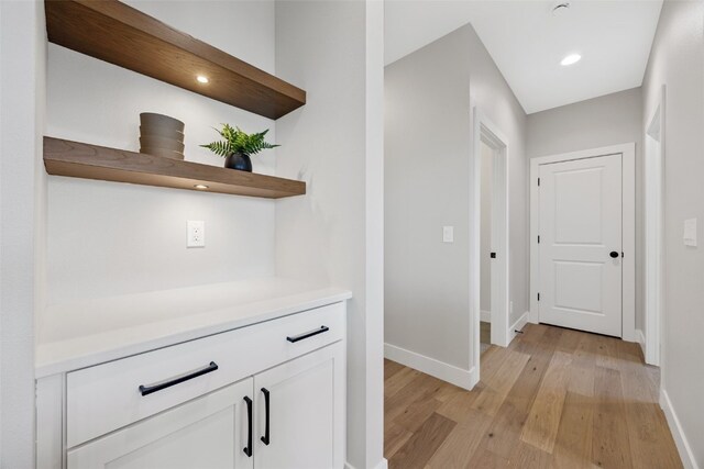1510 Cardinal Dr, Fairfax, IA 52228 - corridor with baseboards and light wood-style floors