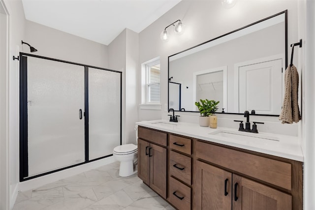 1510 Cardinal Dr, Fairfax, IA 52228 - full bath featuring a shower stall, marble look tile flooring, double vanity, and toilet