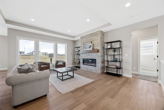 1510 Cardinal Dr, Fairfax, IA 52228 - living room with a fireplace, wood finished floors, baseboards, and recessed lighting