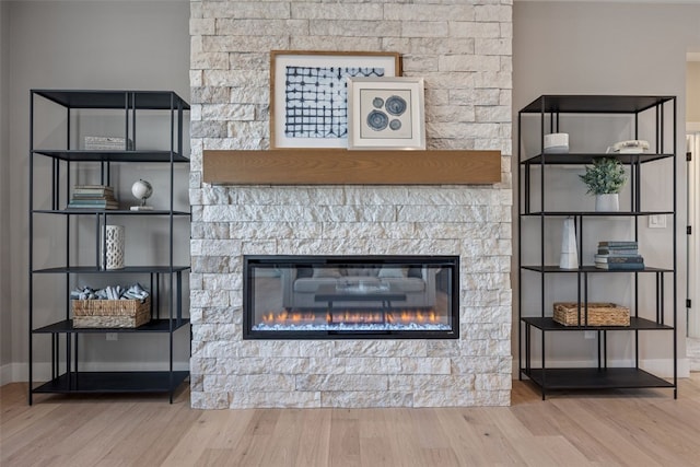 1510 Cardinal Dr, Fairfax, IA 52228 - detailed view of wood finished floors and a stone fireplace