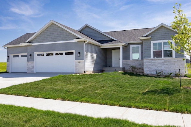 1510 Cardinal Dr, Fairfax, IA 52228 - view of front facade featuring an attached garage, a front lawn, driveway, stone siding, and a shingled roof
