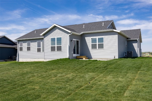 1510 Cardinal Dr, Fairfax, IA 52228 - back of property with a yard, roof with shingles, and cooling unit