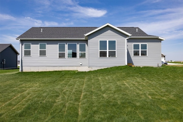 1510 Cardinal Dr, Fairfax, IA 52228 - rear view of property with a lawn and a shingled roof