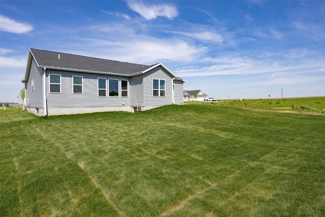 1510 Cardinal Dr, Fairfax, IA 52228 - back of property with a yard and roof with shingles