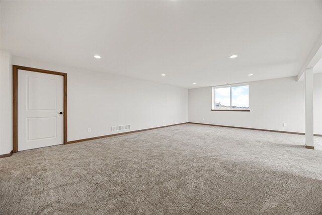 1519 Cardinal Dr, Fairfax, IA 52228 - kitchen with stainless steel appliances, light wood-style flooring, white cabinets, hanging light fixtures, and a large island with sink