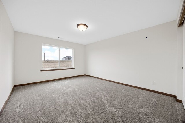 1519 Cardinal Dr, Fairfax, IA 52228 - carpeted empty room featuring baseboards