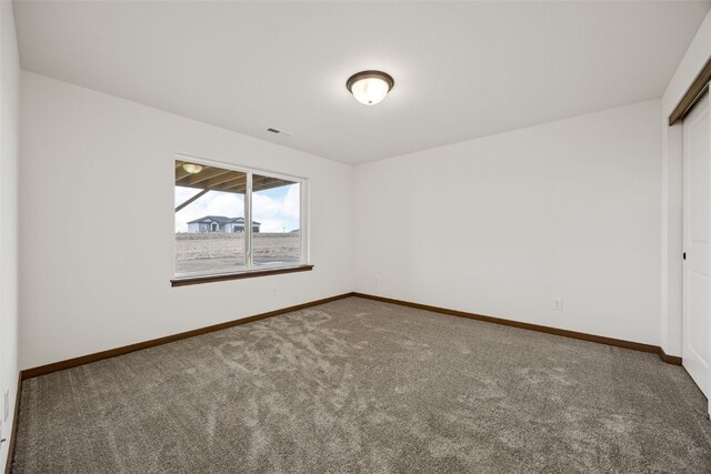 1519 Cardinal Dr, Fairfax, IA 52228 - carpeted spare room featuring baseboards