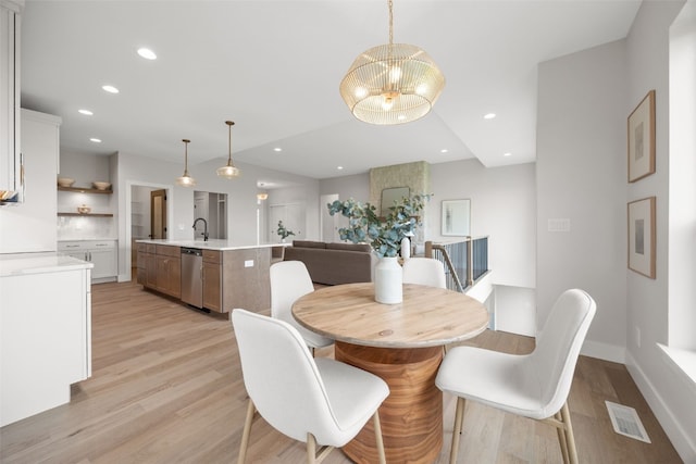 1519 Cardinal Dr, Fairfax, IA 52228 - dining room featuring light wood-type flooring, a chandelier, and recessed lighting