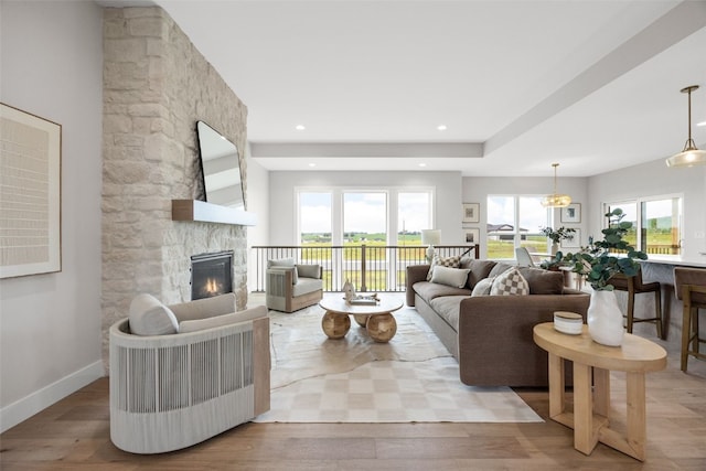 1519 Cardinal Dr, Fairfax, IA 52228 - living room with a fireplace, wood finished floors, and recessed lighting