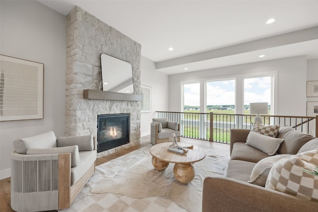 1519 Cardinal Dr, Fairfax, IA 52228 - living room with a stone fireplace, recessed lighting, and wood finished floors