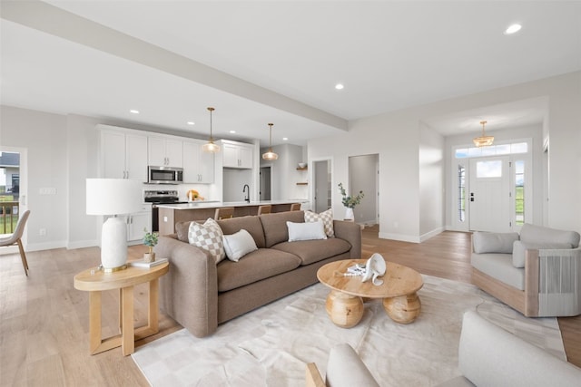 1519 Cardinal Dr, Fairfax, IA 52228 - living area featuring light wood-type flooring and recessed lighting