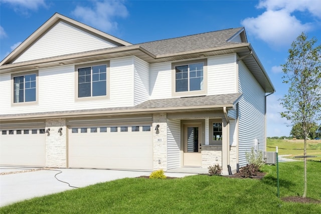 view of front of home with a garage and a front yard