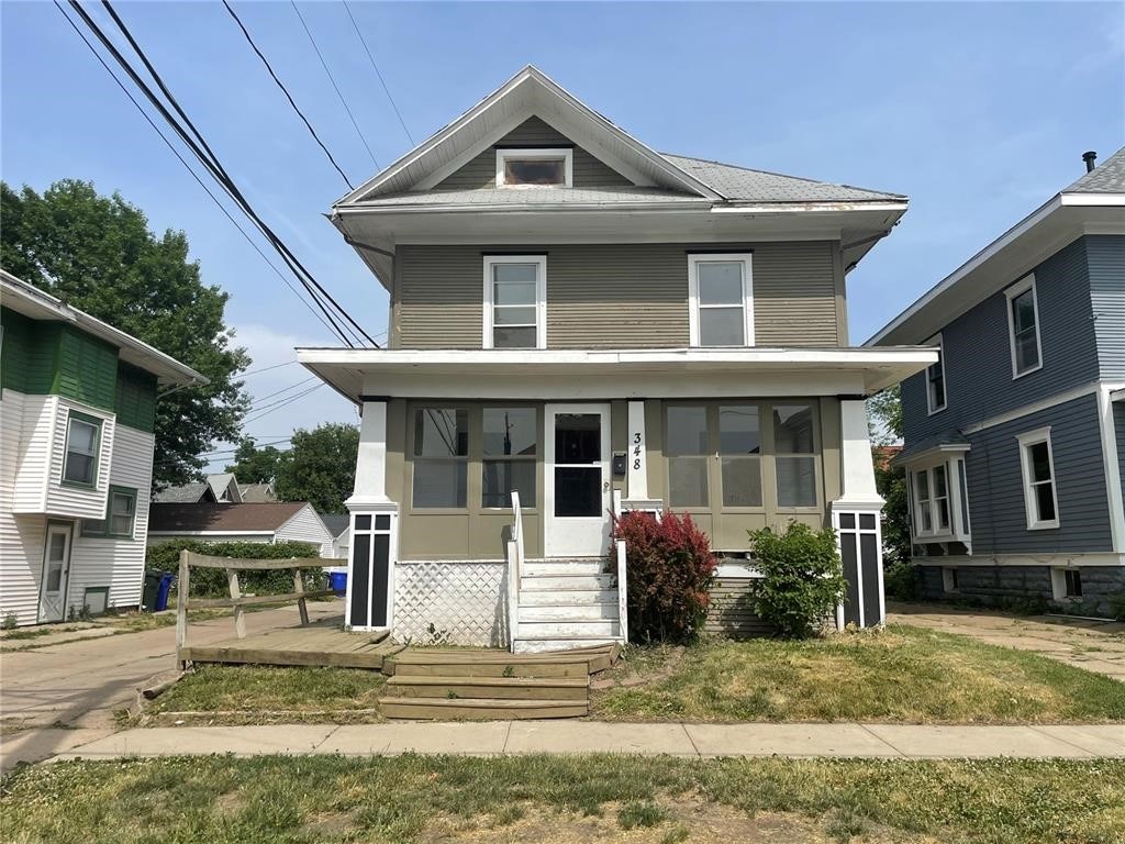 view of front of house with a sunroom