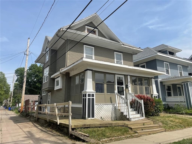 view of front of house featuring a sunroom