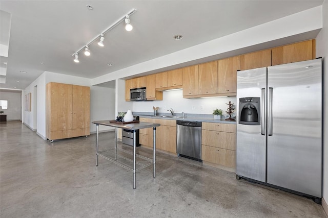 kitchen with rail lighting, light brown cabinetry, sink, and appliances with stainless steel finishes