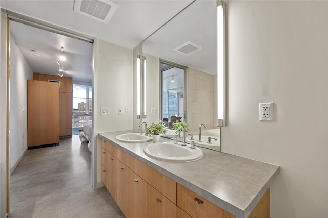 bathroom with vanity and concrete floors