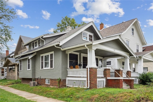 view of front of house with cooling unit and covered porch