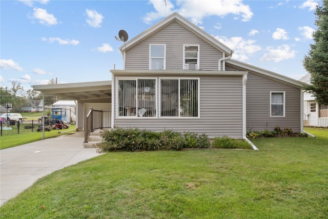 view of front of property with a front yard and a carport