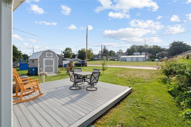 deck featuring a yard and a shed