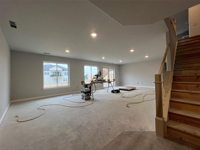 exercise room featuring baseboards and recessed lighting