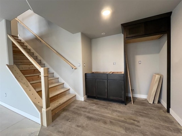 interior space featuring recessed lighting, wood finished floors, and baseboards