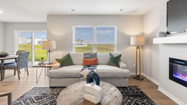 living room with light hardwood / wood-style floors