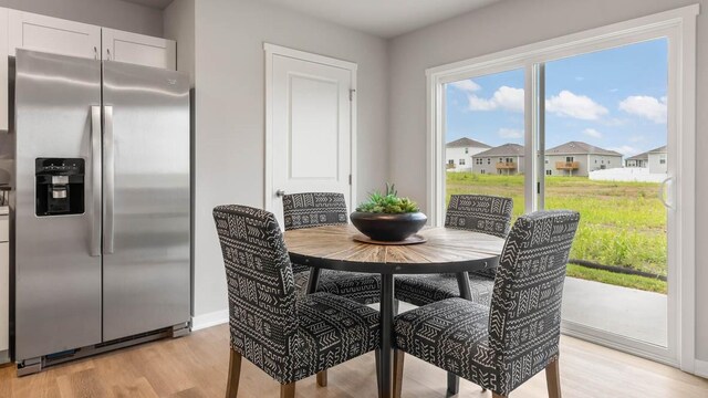 dining area with light hardwood / wood-style flooring