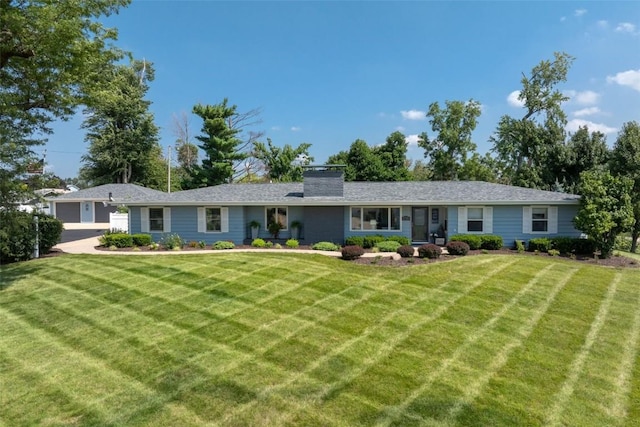 rear view of property featuring a lawn and a chimney