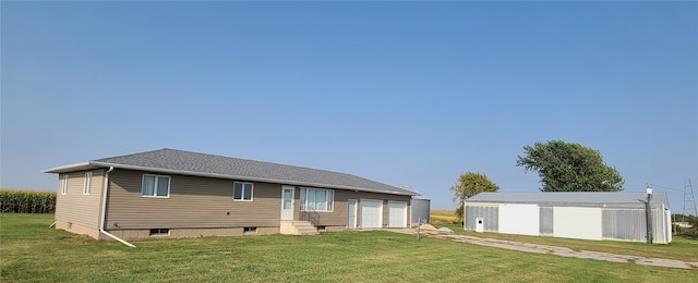 rear view of property featuring a yard