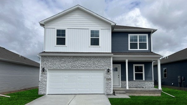 view of front property with a garage and a front lawn