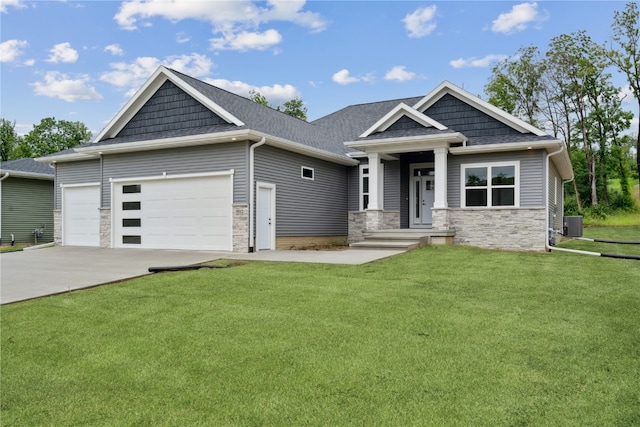 craftsman-style home with a front yard and a garage