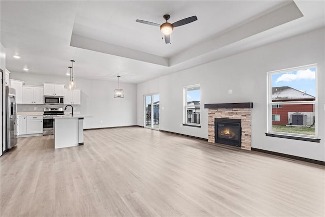 living room with light hardwood / wood-style floors and a wealth of natural light