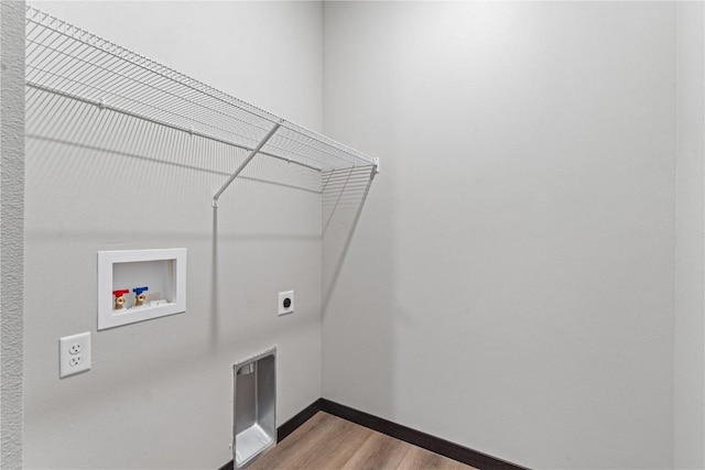 laundry room with hookup for a washing machine, light hardwood / wood-style flooring, and hookup for an electric dryer