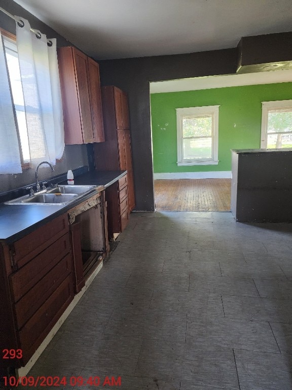 kitchen featuring a wealth of natural light, sink, and dark hardwood / wood-style flooring