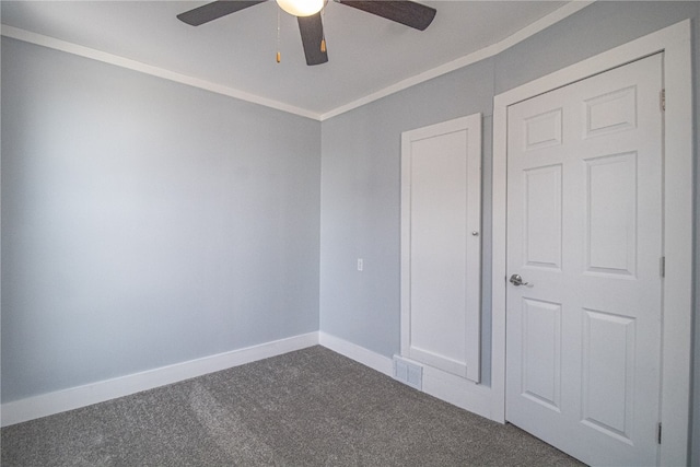 unfurnished bedroom with carpet, ornamental molding, and ceiling fan