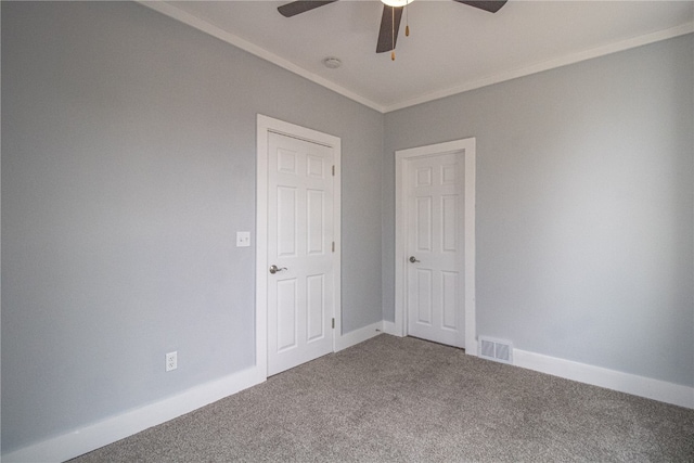 unfurnished bedroom with ceiling fan, crown molding, and carpet flooring