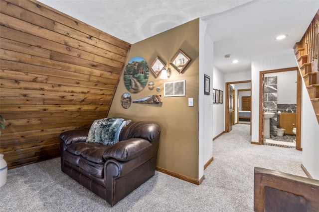 living area with light colored carpet and lofted ceiling