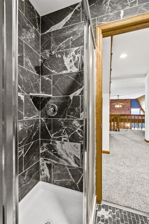 bathroom with tiled shower