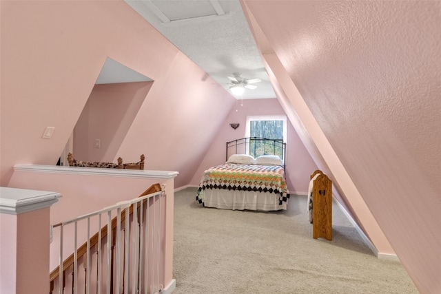 carpeted bedroom with lofted ceiling, ceiling fan, and a textured ceiling