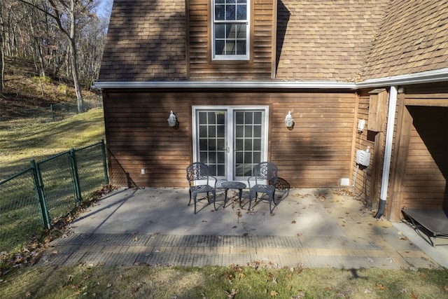 rear view of house featuring french doors and a patio area