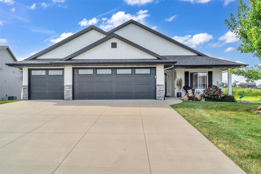 view of front of home with a garage and a front yard