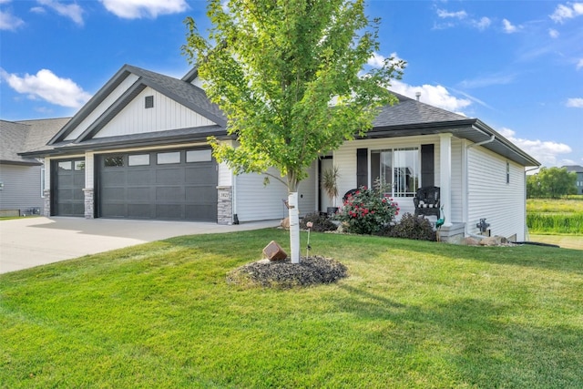 view of front of house with a garage and a front lawn