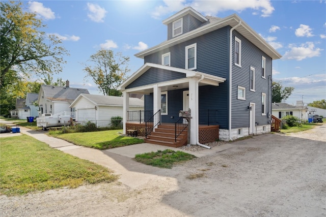 view of front of property with a front yard and covered porch