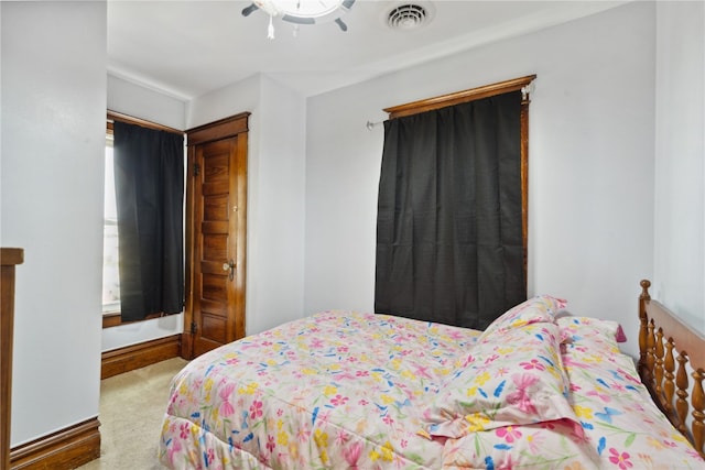 bedroom featuring ceiling fan and carpet