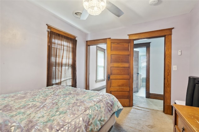 bedroom featuring ceiling fan and light colored carpet