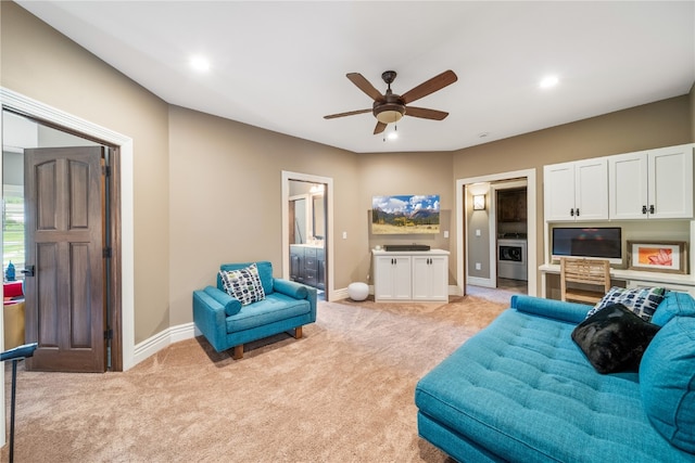 carpeted living room featuring ceiling fan