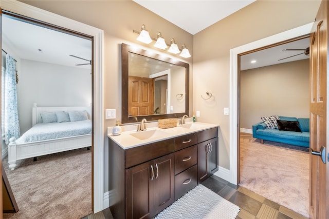 bathroom with ceiling fan and vanity